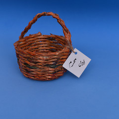wooden basket on the blue background with different notes hung on it
