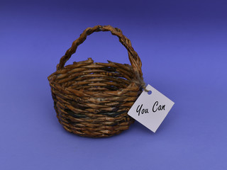 wooden basket on the blue background with different notes hung on it