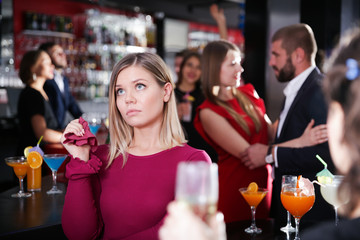 Girl upset because boyfriend flirting with other woman in bar