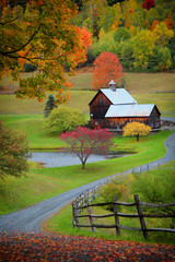 Barn in Vermont country side surrounded by autumn trees