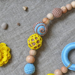 multi-colored knitted and wooden beads
