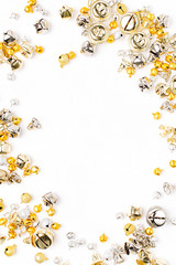 Gold and silver Jingle bells Christmas background. Flat lay,  top view