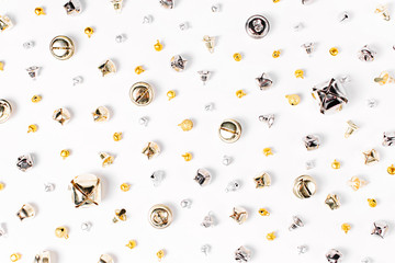 Jingle bells pattern. Christmas background in gold and silver colors. Flat lay,  top view