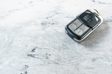 Door remote on marble.
