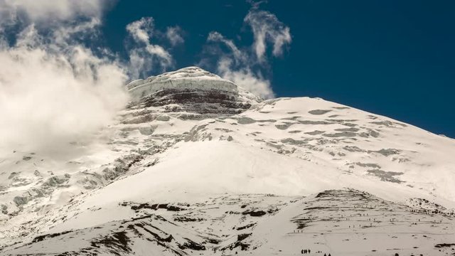 The summit of Cotopaxi Volcano after a heavy snowfall, Time-lapse. With climbers making their way upslope to the refuge. Situated in the Ecuadorian Andes, at 5897m one of the worlds highest volcanoes