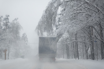 Truck drives through cold weather conditions