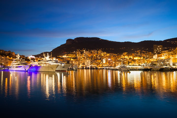 Fototapeta na wymiar Monaco City Lights at Twilight with Reflection in the Mediterranean Sea