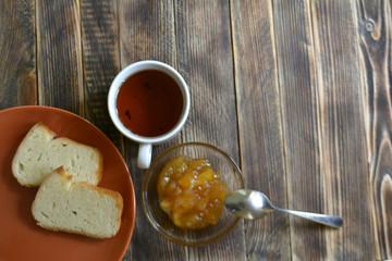 toast apple jam tea cup on the table
