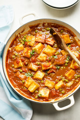 Matar paneer with with paneer cheese, peas and tomato sauce.