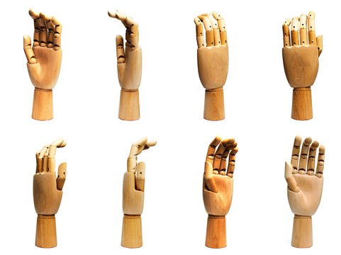 Wooden Hand isolated on a white background from different angles.