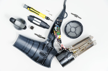 Hair dryer in a disassembled condition - obrazy, fototapety, plakaty