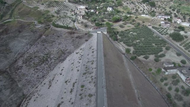 Aerial shot along a dam or dyke
