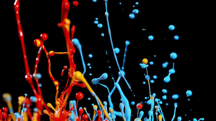 Abstract coloured paint splashes on black