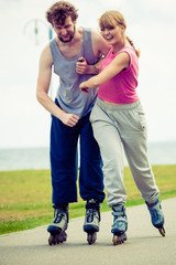 roller skater couple skating outdoor