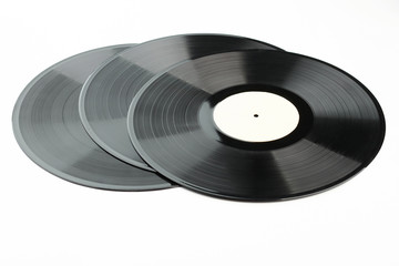 Set of vinyl records over white background. Three gramophone plates. Retro music objects.