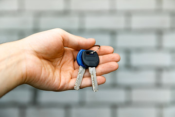 Man is handing a house key