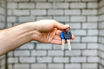 Man is handing a house key