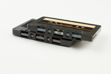 Two retro cassettes on white background. Plastic cassette tapes over white background. Music retro...