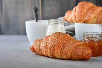 coffee with milk and croissants, jam