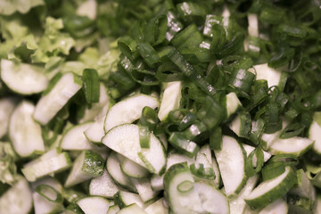 Cucumbers, salad leaves and spring onions