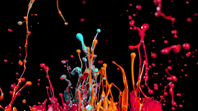 Abstract coloured paint splashes on black