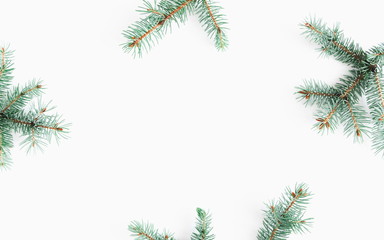 Christmas composition. Frame made of fir branches on white background. Flat lay, top view, copy space. 