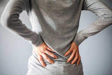 Woman suffering from low back pain