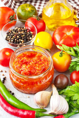 Tomato paste, sauce in glass jar and fresh tomatoes