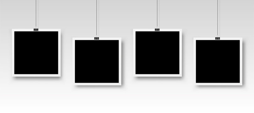 Four photo frames hanging on a clip. Vector