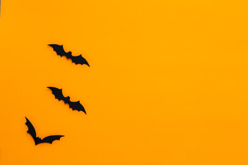 Bats with an orange background. Halloween concept.