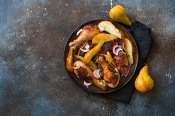 Grilled chicken drumsticks and pears