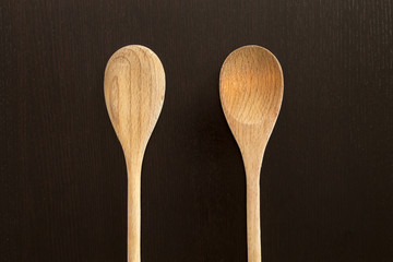 Wooden spoons on black table