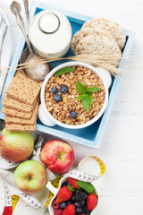 Healthy breakfast set with muesli, berries and milk