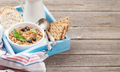 Healthy breakfast set with muesli, berries and milk