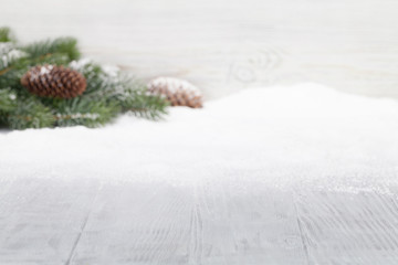 Christmas table backdrop with fir tree covered by snow