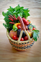 California harvest in woven basket on wooden background 