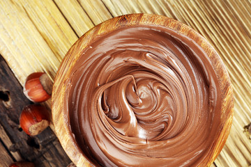 Homemade hazelnut spread in wooden bowl. Hazelnut Nougat cream