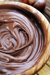 Homemade hazelnut spread in wooden bowl. Hazelnut Nougat cream