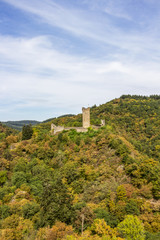 Fototapeta premium Colored autumn view to the ruins of Oberburg or Upper Castle in Manderscheid, Germany