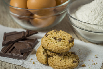 Homemade oatmeal cookies on wooden board.
