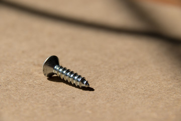 Closeup screw, screws, isolated, metal, silver, shiny.