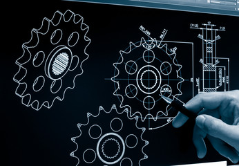 engineer working on computer at mechanical piece design cad blueprint monochrome image