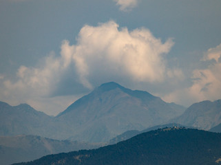 Cloud Formation Behind Mountain Peak