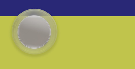 Small graphic button on green and blue yellow background