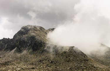 Geyser Shaped Cloud Coming from Mountain Crater