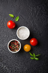 Red and yellow fresh tomatos, basil and olive oil