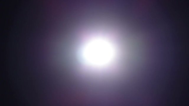 Light of the torch moving in the dark night