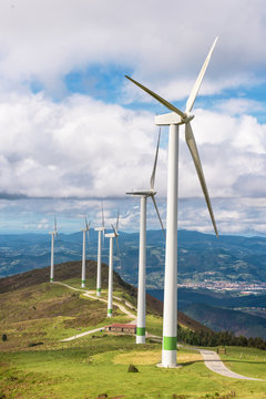 Renewable energy. Wind turbines, eolic park in scenic landscape of basque country, Spain.