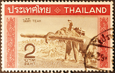 Elephant at work on thai postage stamp