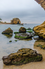 The photo of the stone on the beach on the long exposure